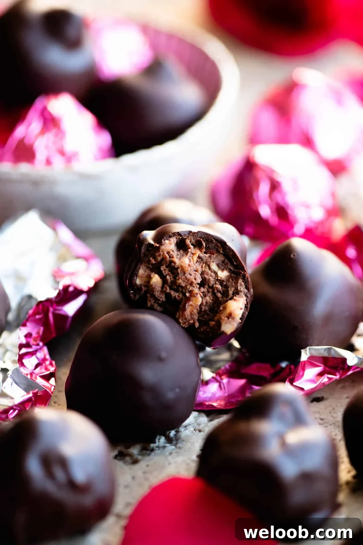 A close up of an Italian hazelnut chocolate bitten in half showing the inside.