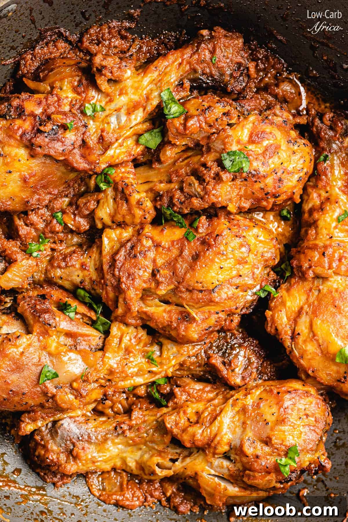 Moambe Chicken in a dish.