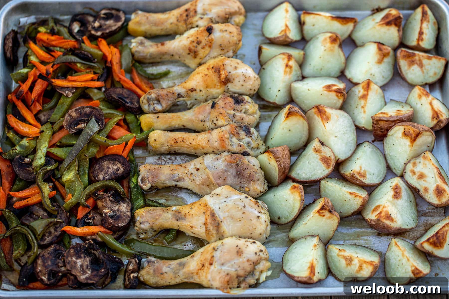 landscape photo of baked chicken potatoes and veggies