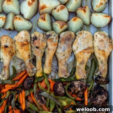 Roasted chicken, potatoes and veggies on a sheet pan