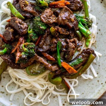 Beef stir fry over noodles