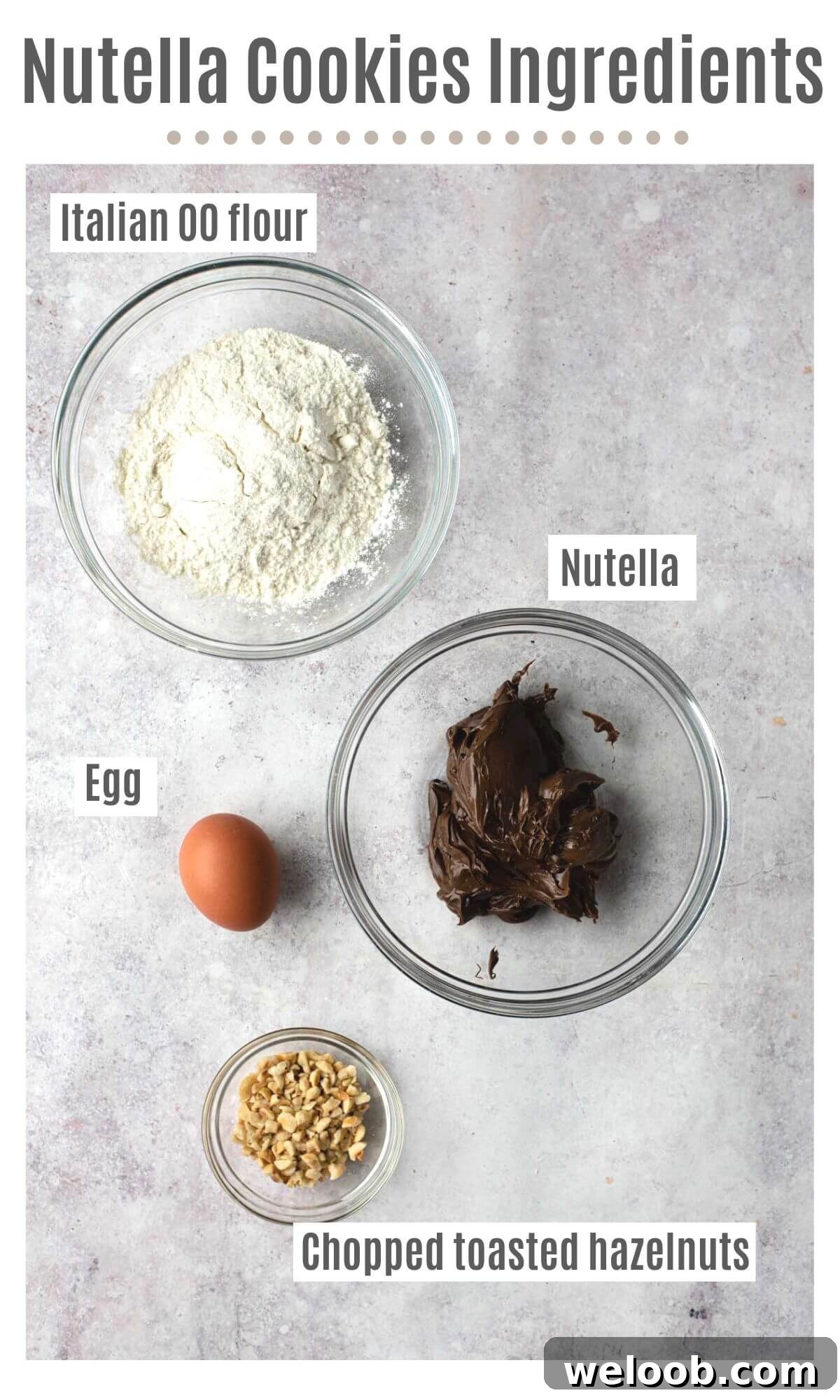 An overhead shot of all the ingredients you need to make Nutella cookies; flour, Nutella, egg and chopped toasted hazelnuts.
