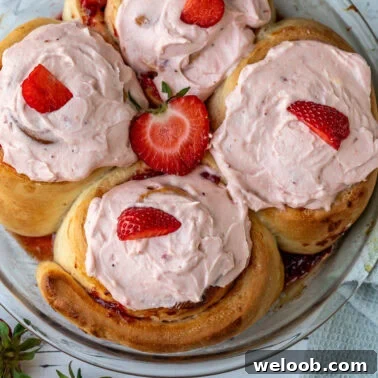 Square image of strawberry cinnamon rolls.