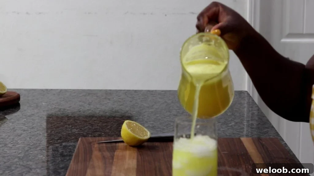 Pouring drink over ice