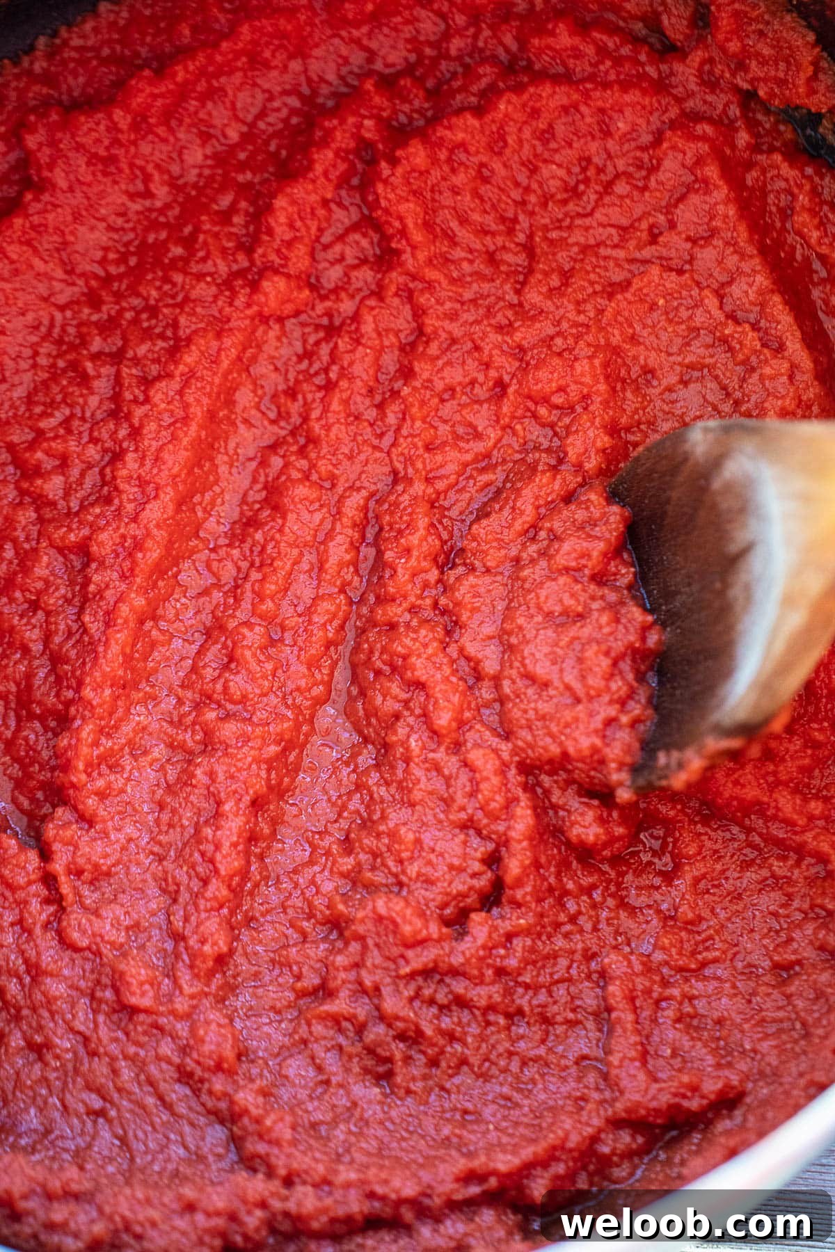 Reduce tomato pure in pot