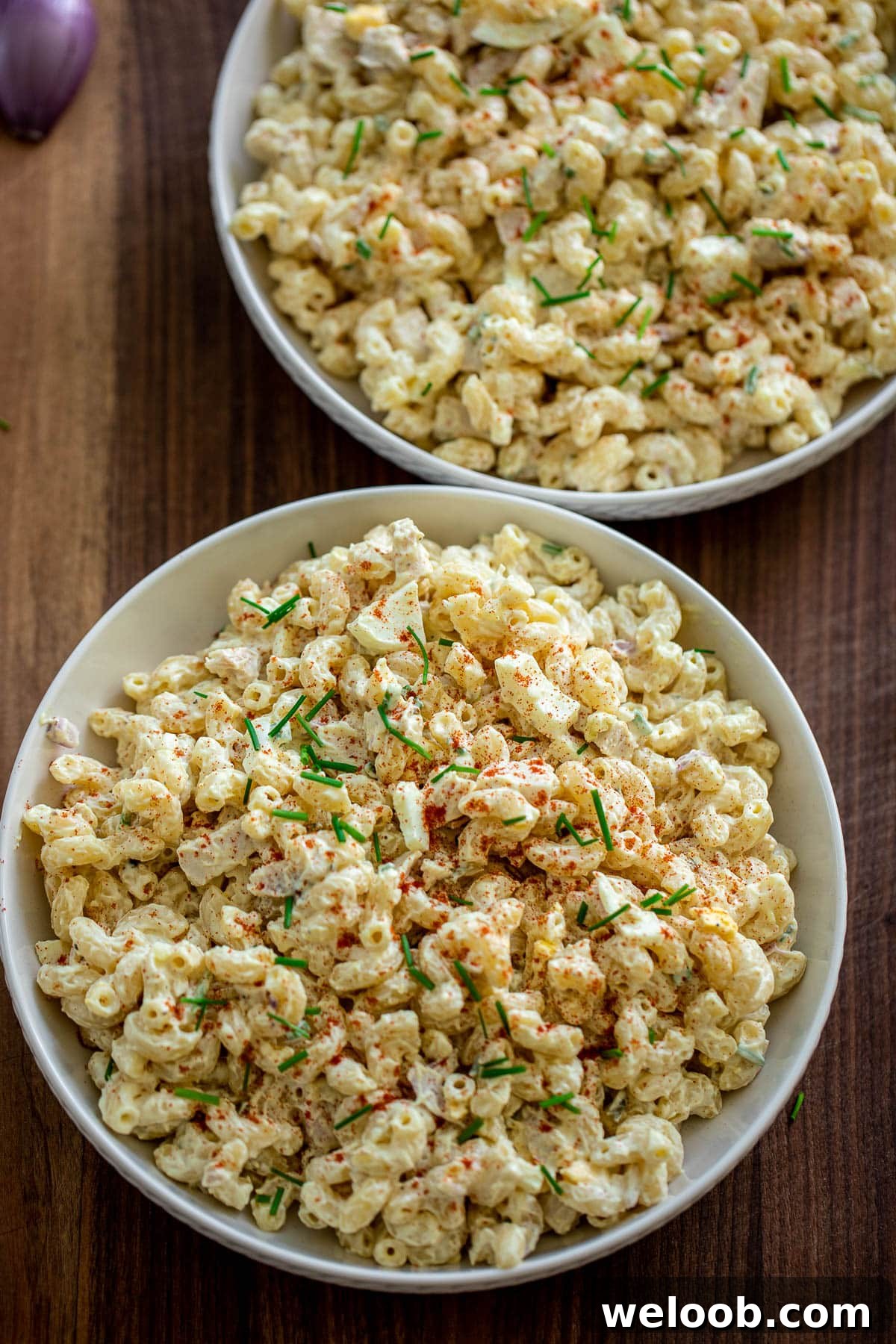Two large bowls of chicken macaroni salad