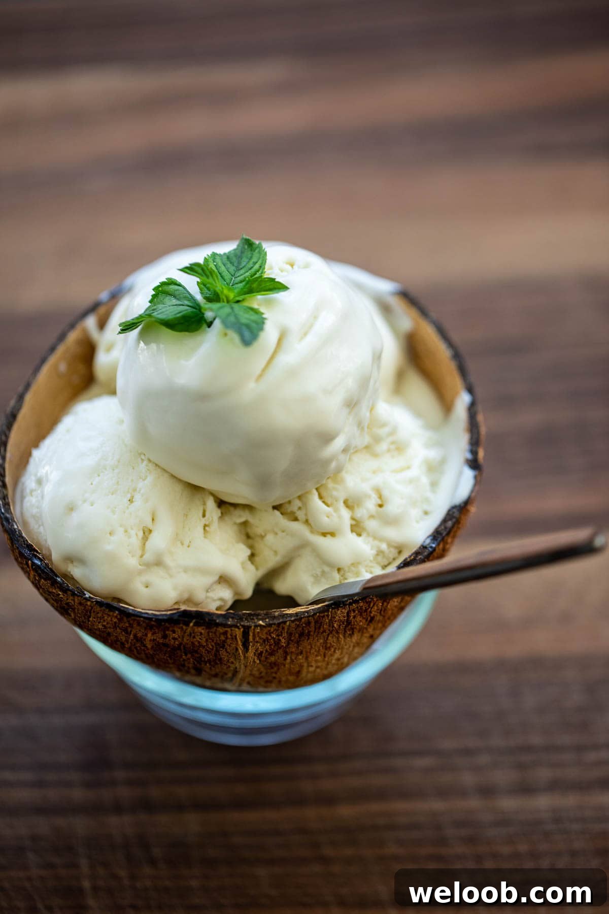3 large scoops of coconut ice cream in a bowl