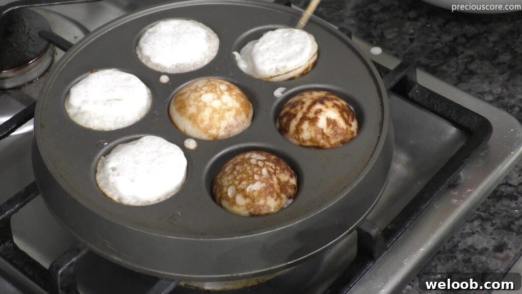 Cooking rice pancakes on Aebleskiver pan