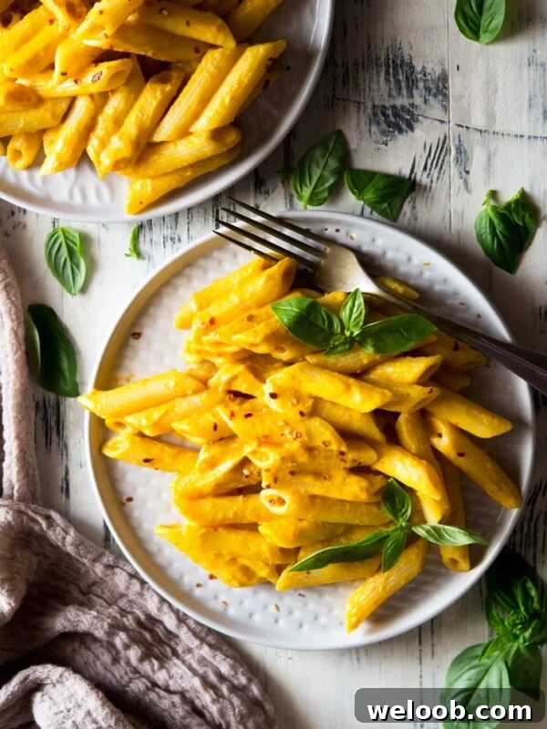 butternut squash pasta in a plate with basil