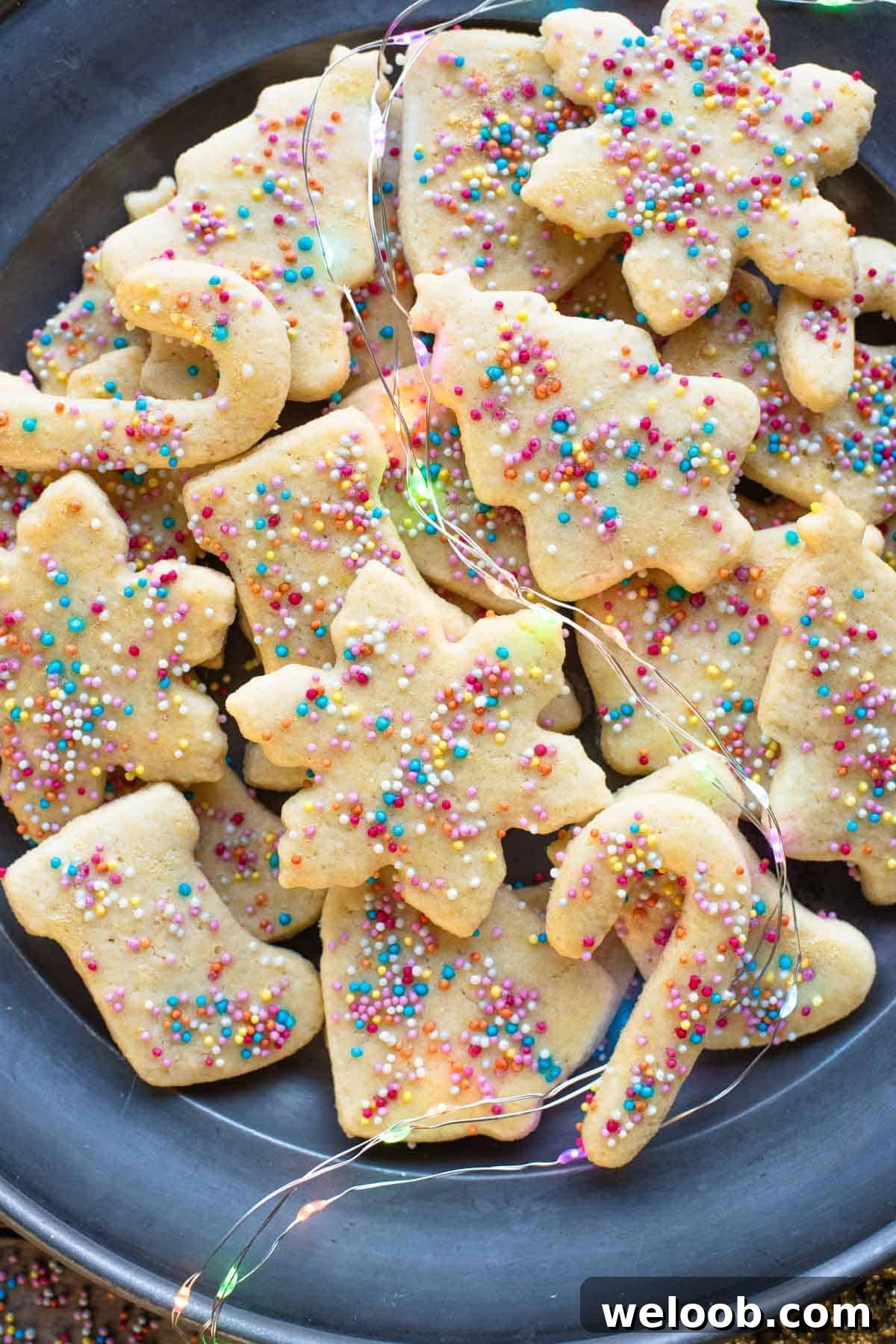 A close up of Befanini Christmas cookies on a plate.