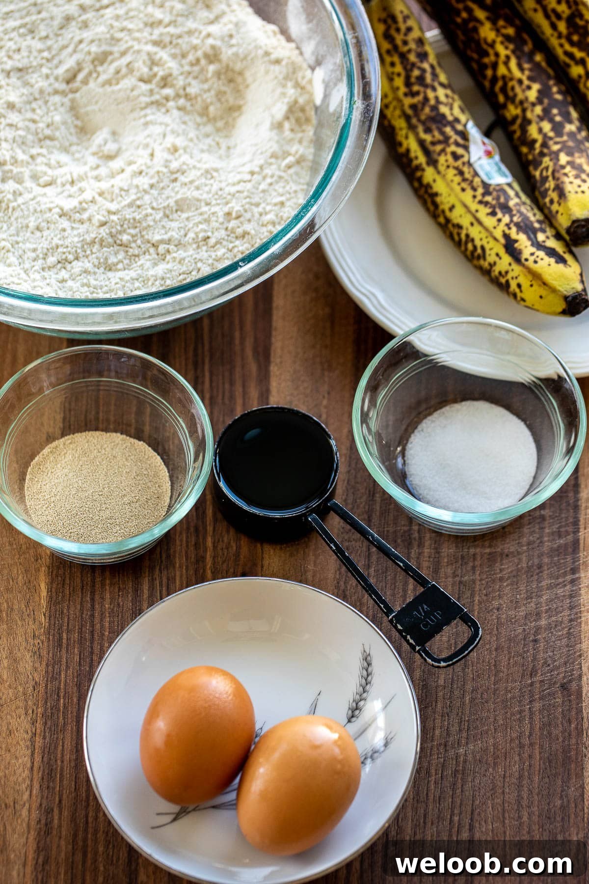 Ingredients for bread rolls made with banana on a chopping board