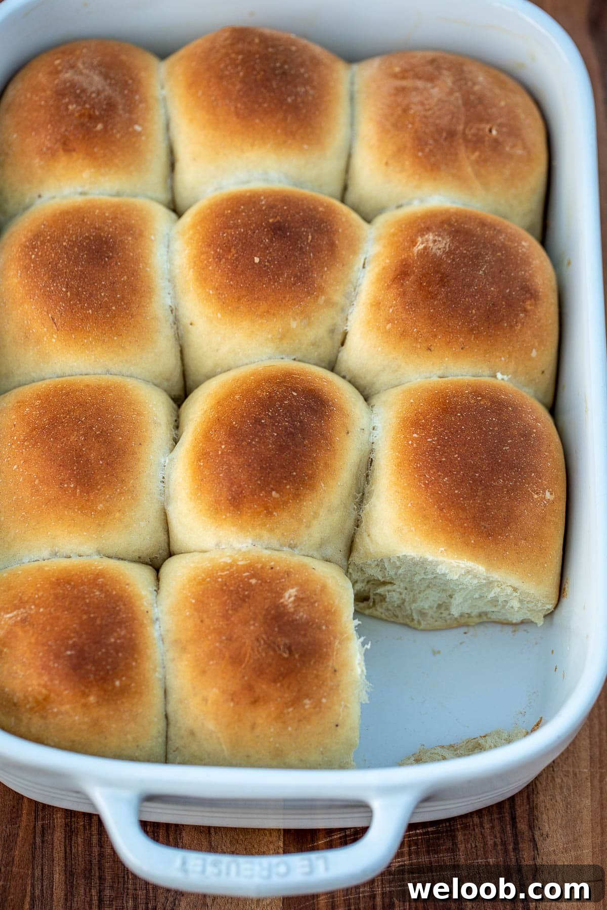 Bread rolls in a pan with one missing