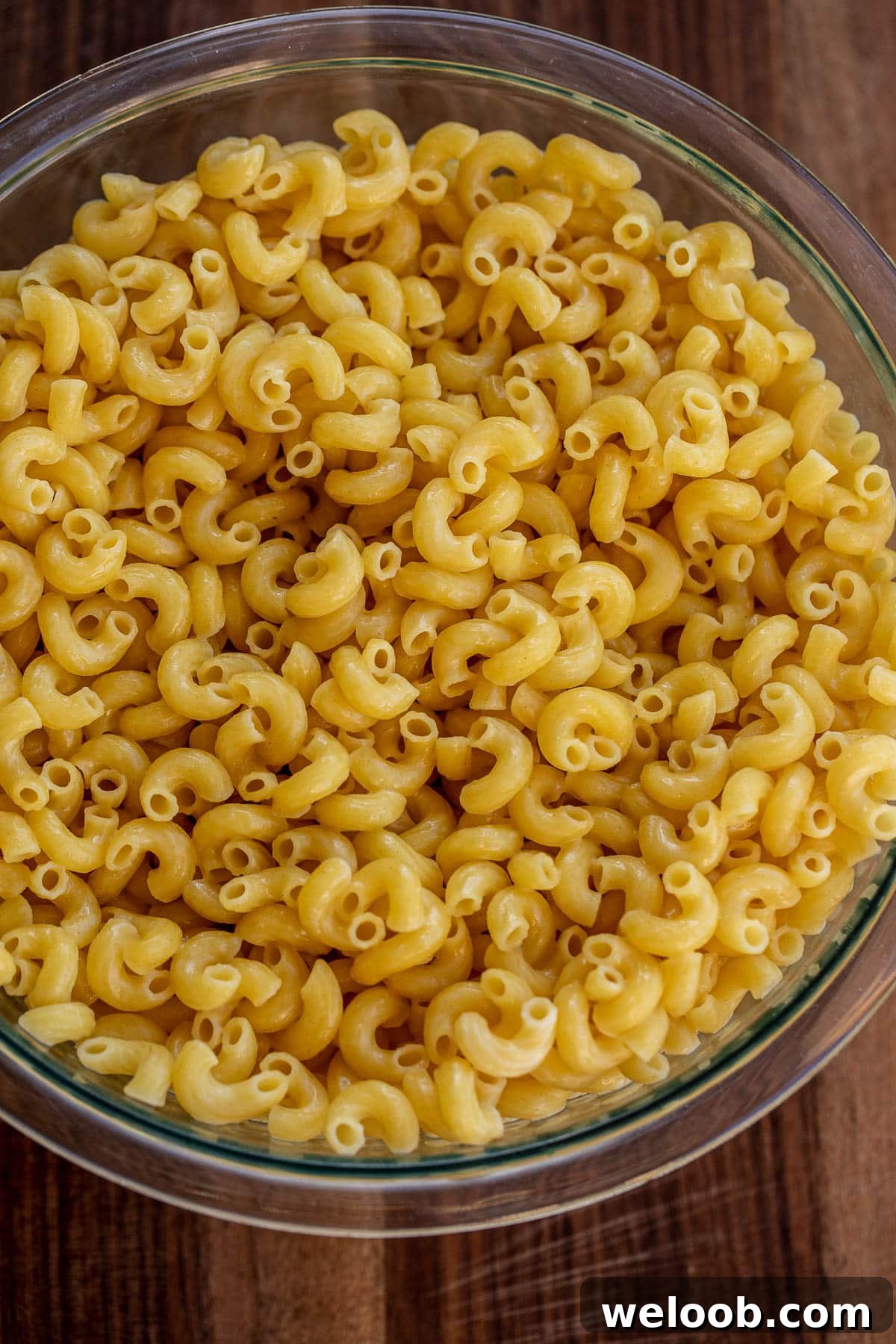 Bowl of cooked macaroni tossed with butter