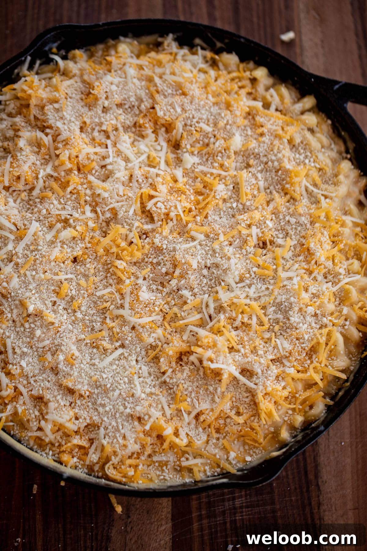 Mac and cheese topped with shredded cheese and breadcrumbs