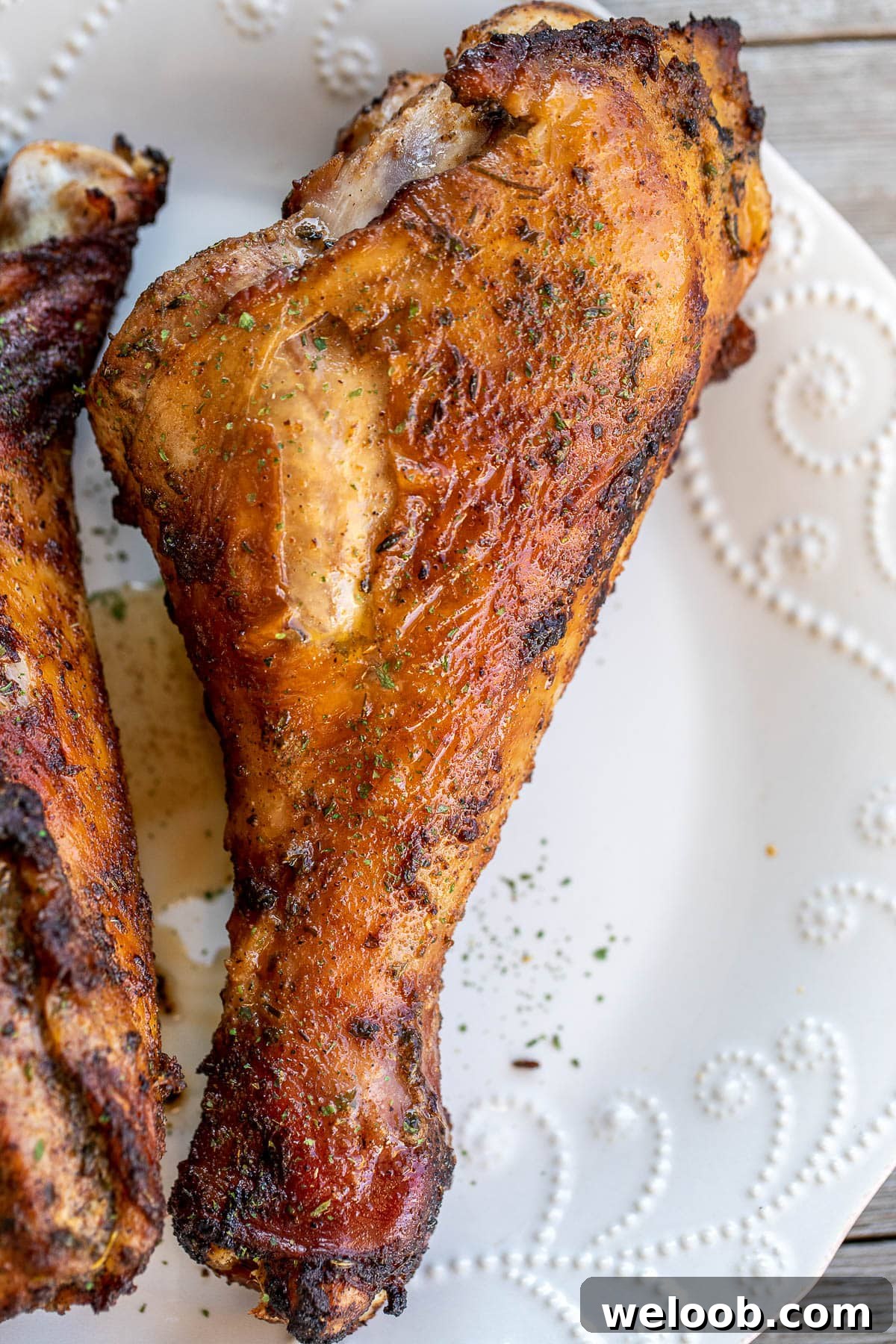 1 turkey drumstick on a white plate.