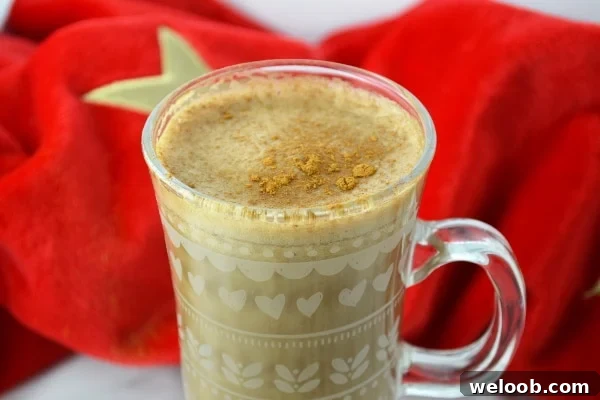 Close up of banana milk coffee topped with cinnamon
