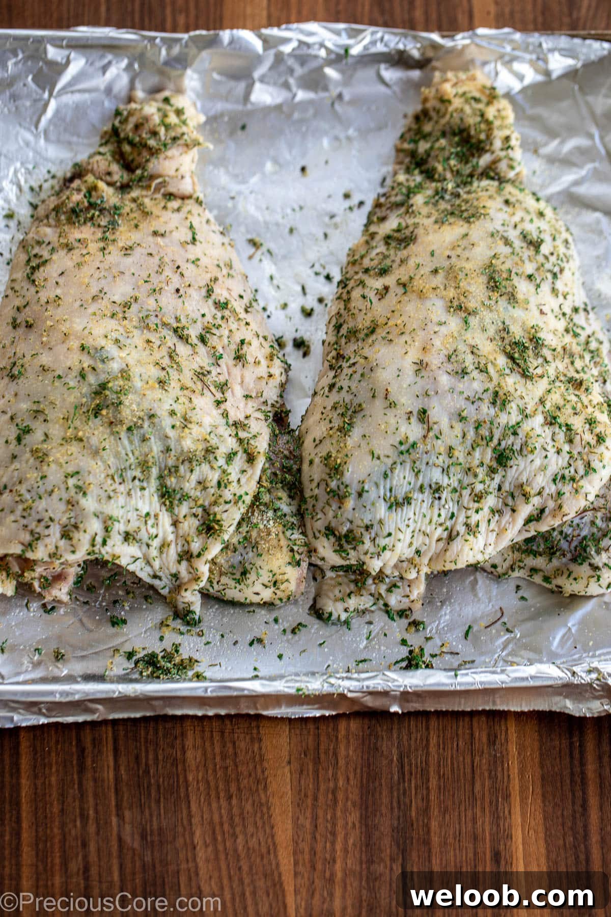Raw seasoned turkey thighs.
