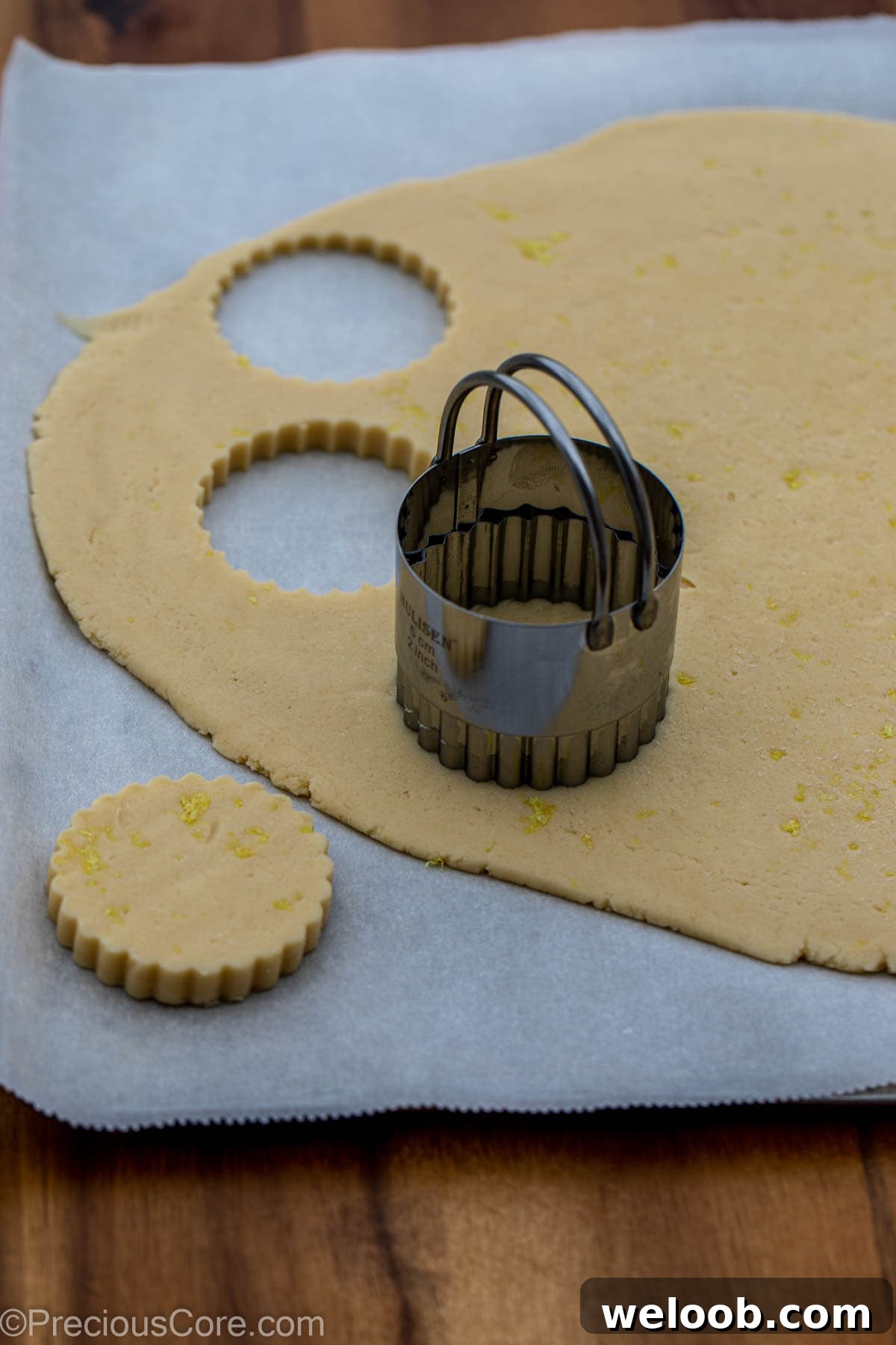 2 inch cookie cutter on dough for cutting out 2-inch circle cookies.