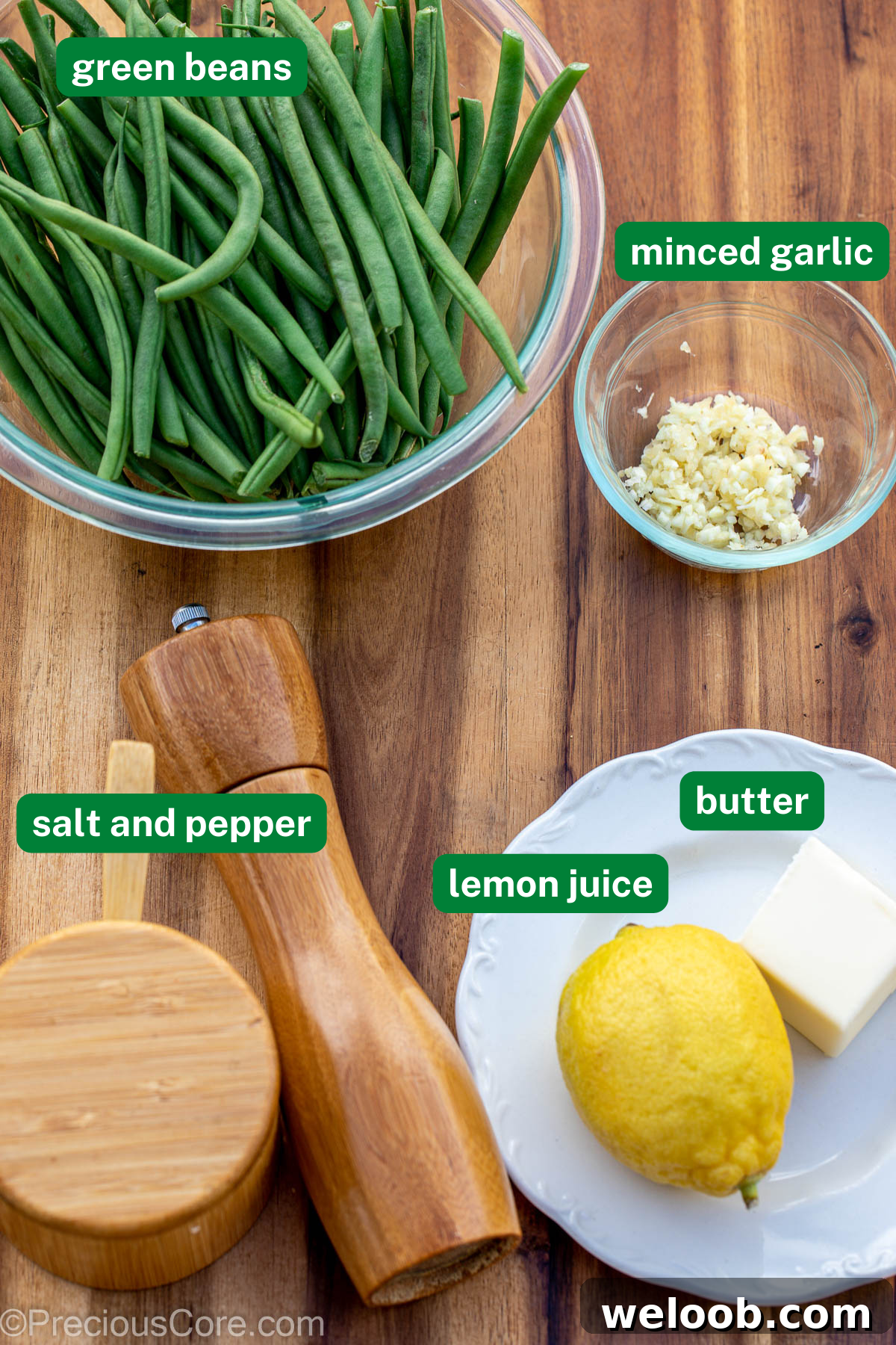 Garlic Butter Green Beans Recipe with Crispy Garlic 4 Fresh green beans, mined garlic, salt and pepper, lemon, and butter on chopping board.