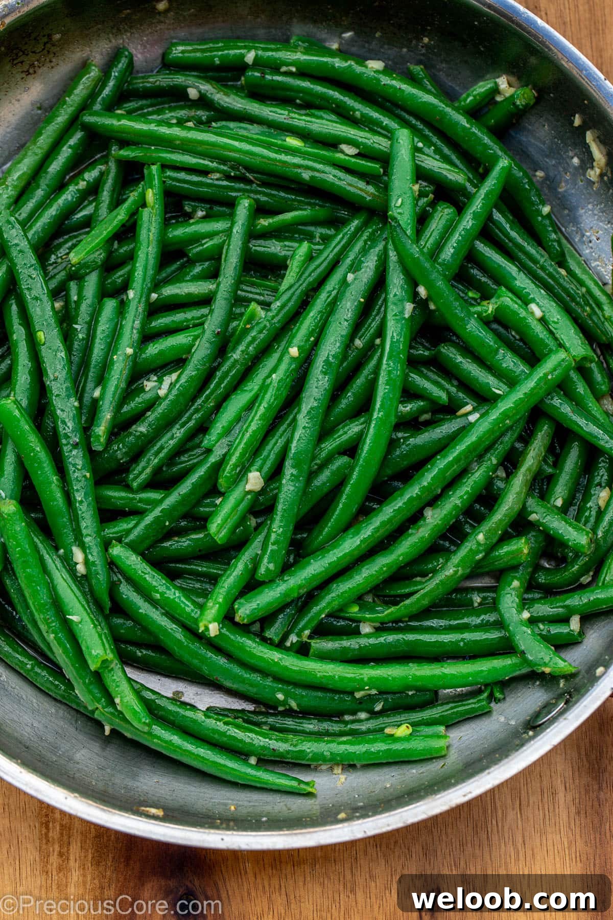 Garlic Butter Green Beans Recipe with Crispy Garlic 9 Green beans in skillet with garlic and butter.
