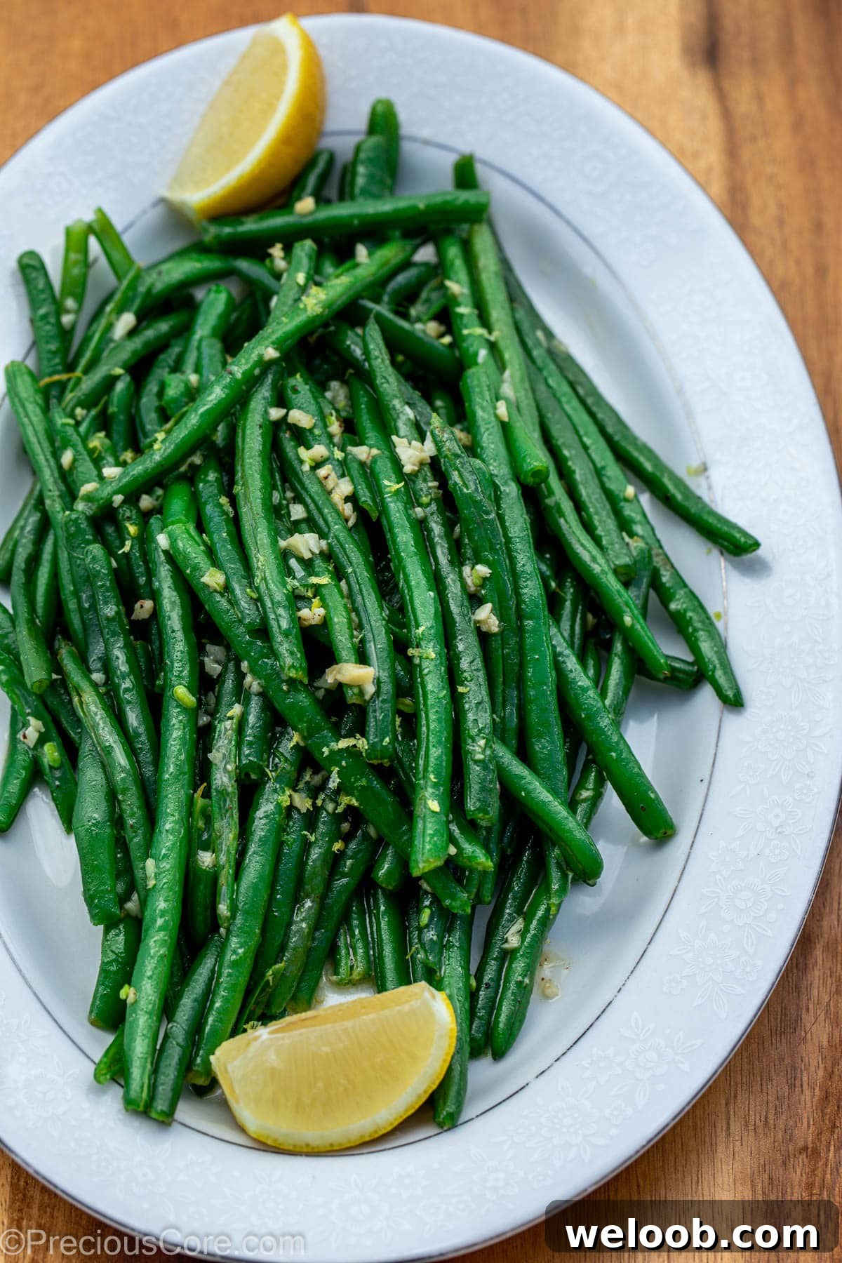 Garlic Butter Green Beans Recipe with Crispy Garlic 10 Garlic butter green beans on tray with lemon juice.