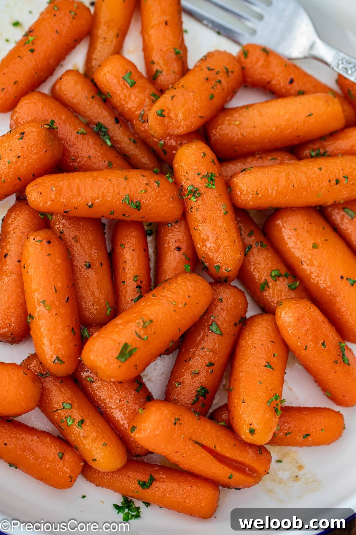 Brown sugar honey glazed carrots on a plate.