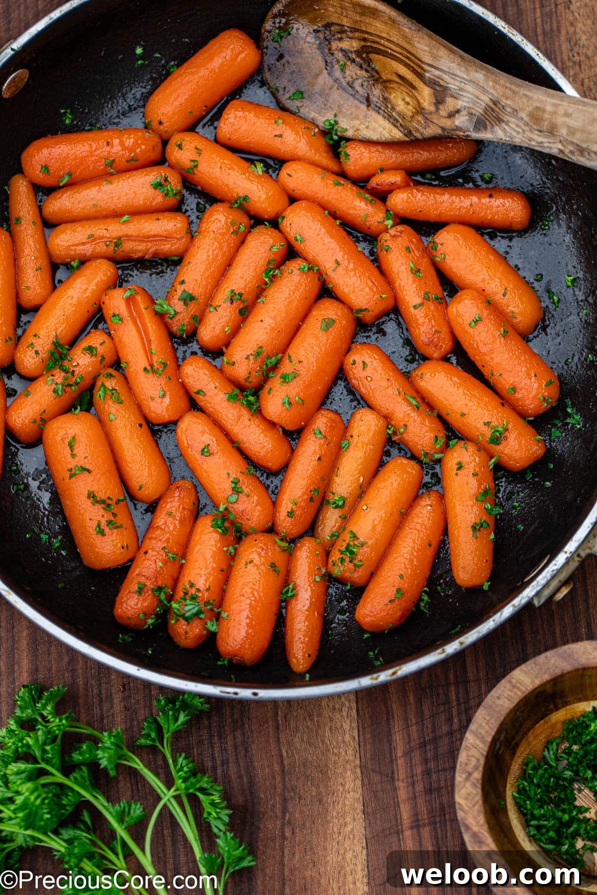 Glazed carrots garnished with fresh parsley.
