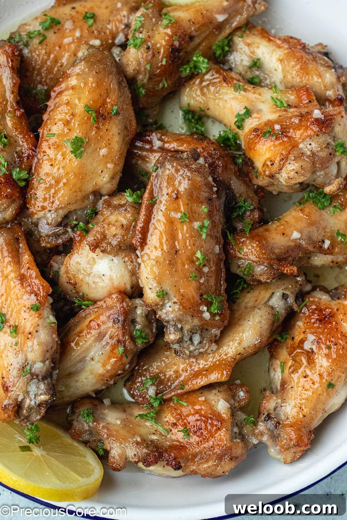Garlic Butter Wings in a white dish.