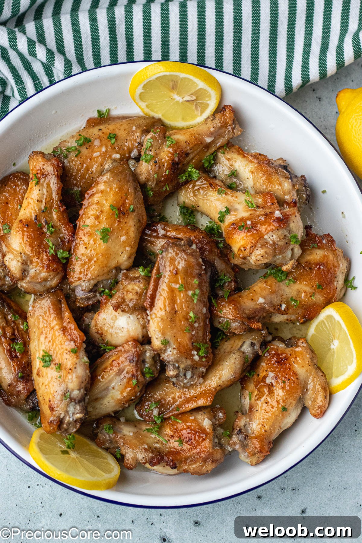 Chicken garnished with minced parsley.
