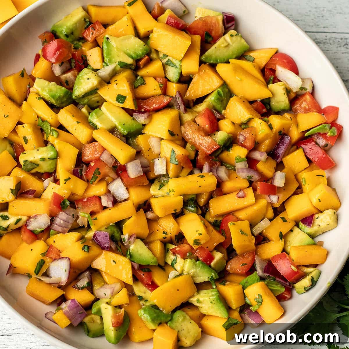 A square image of mango avocado salsa.