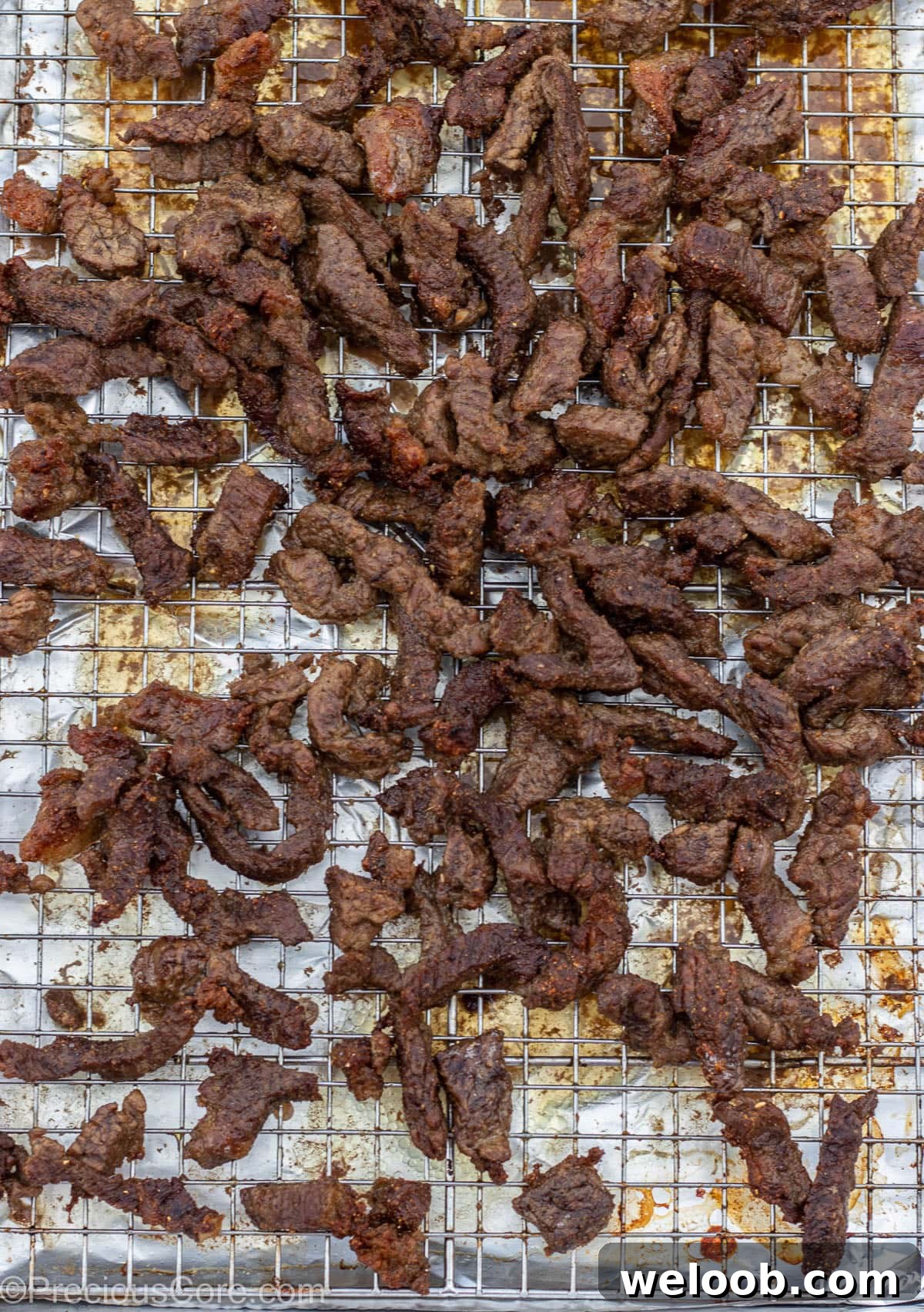 Grilled Cameroonian soya on a baking sheet rack.