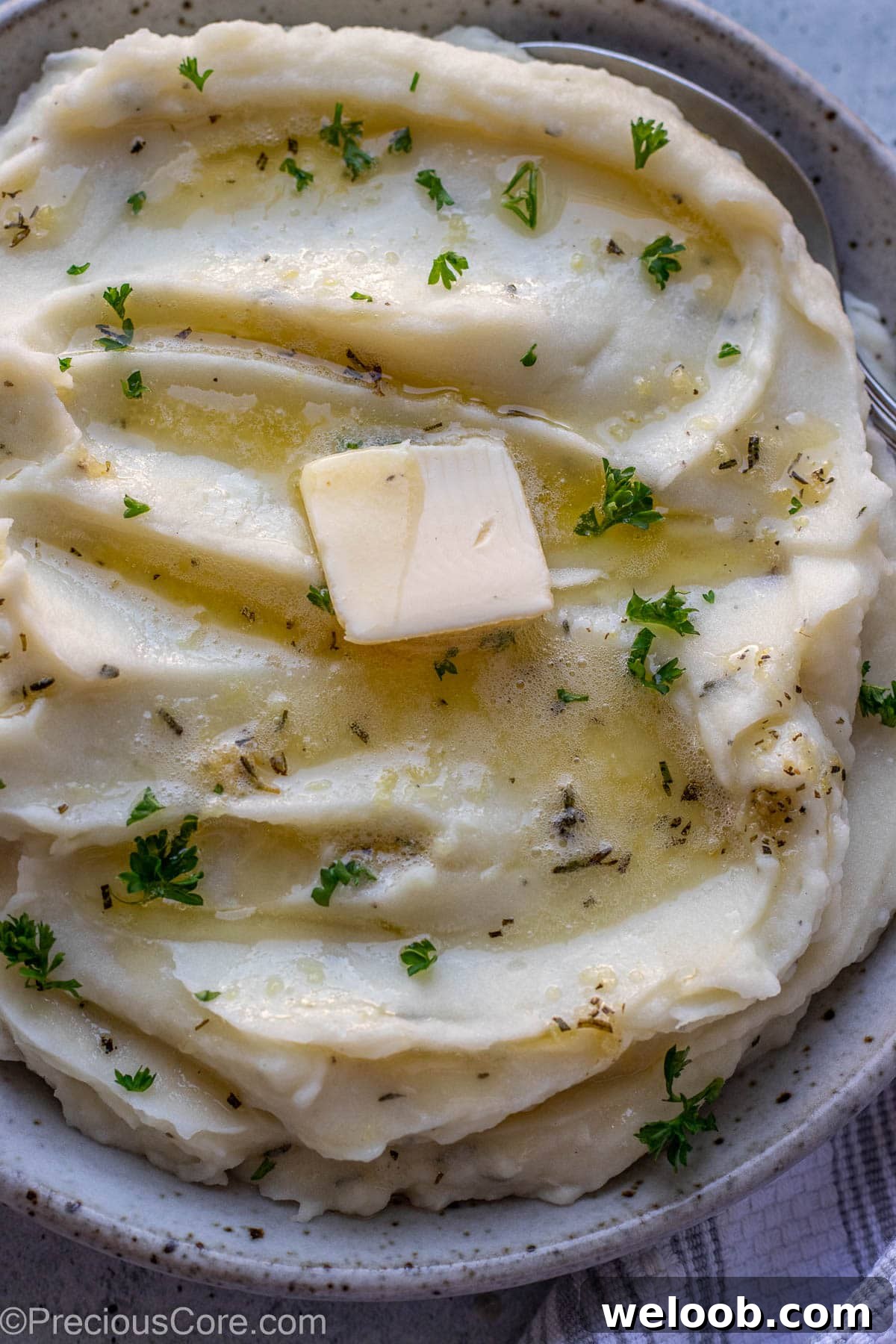 Close up shot of mashed potatoes in a bowl.