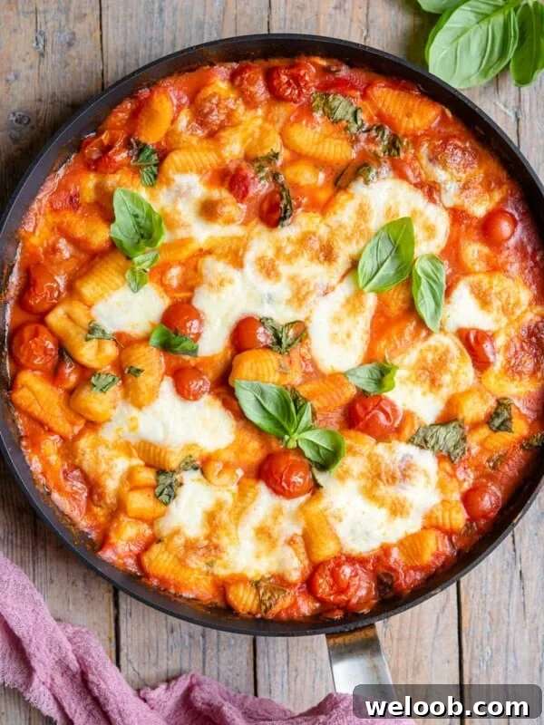 An overhead shot of baked gnocchi in a skillet