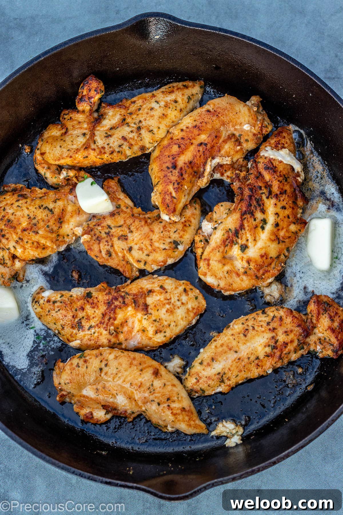 Butter in pan with chicken.