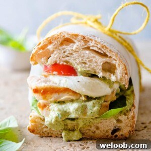 A close up of a chicken pesto ciabatta
