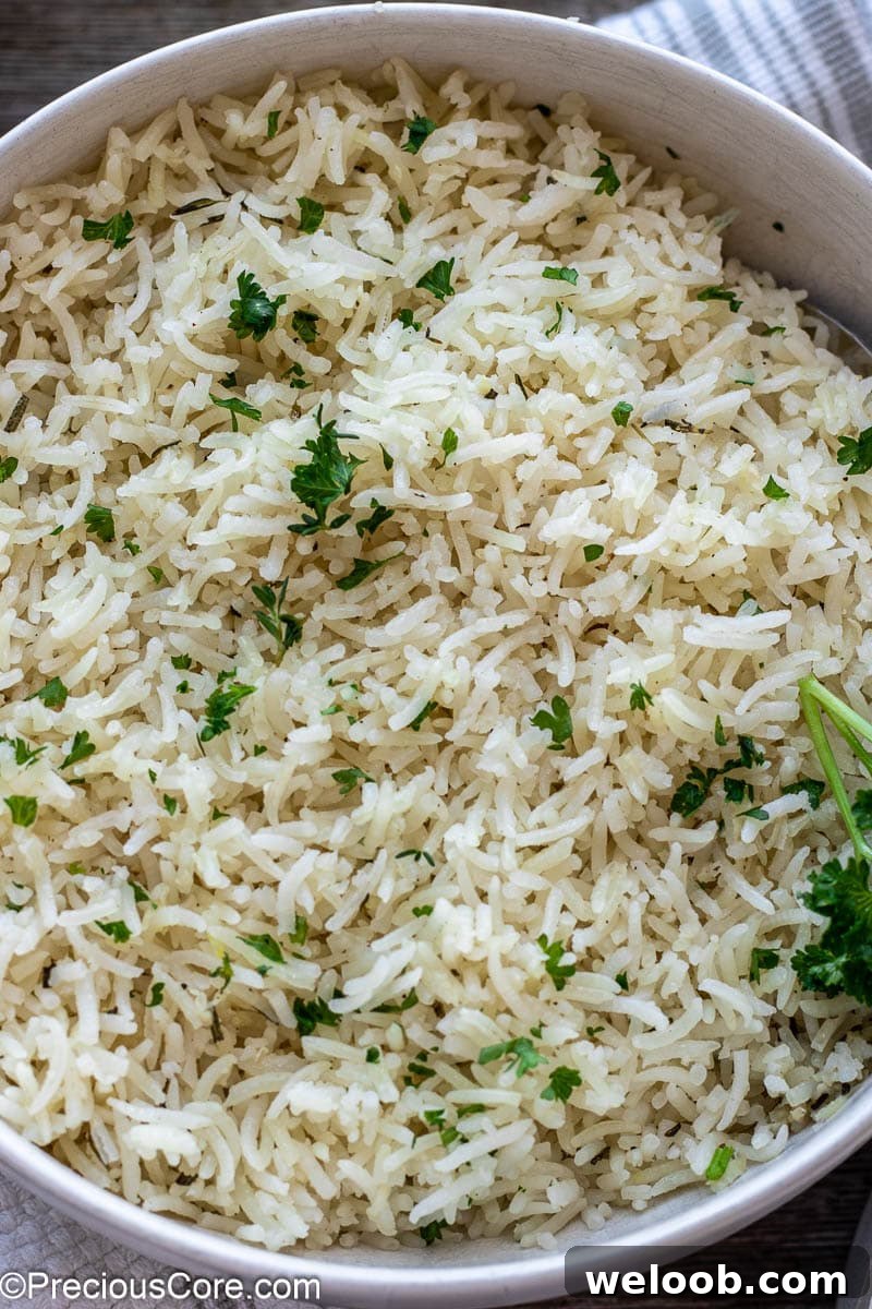 Cooked rice in a white bowl.