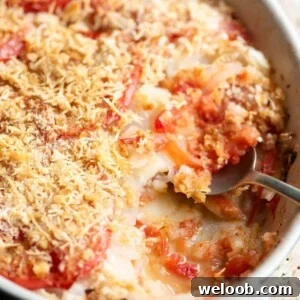 A close up cropped image of an Italian potato and tomato gratin.