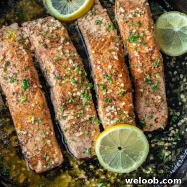 Cooked salmon in pan.