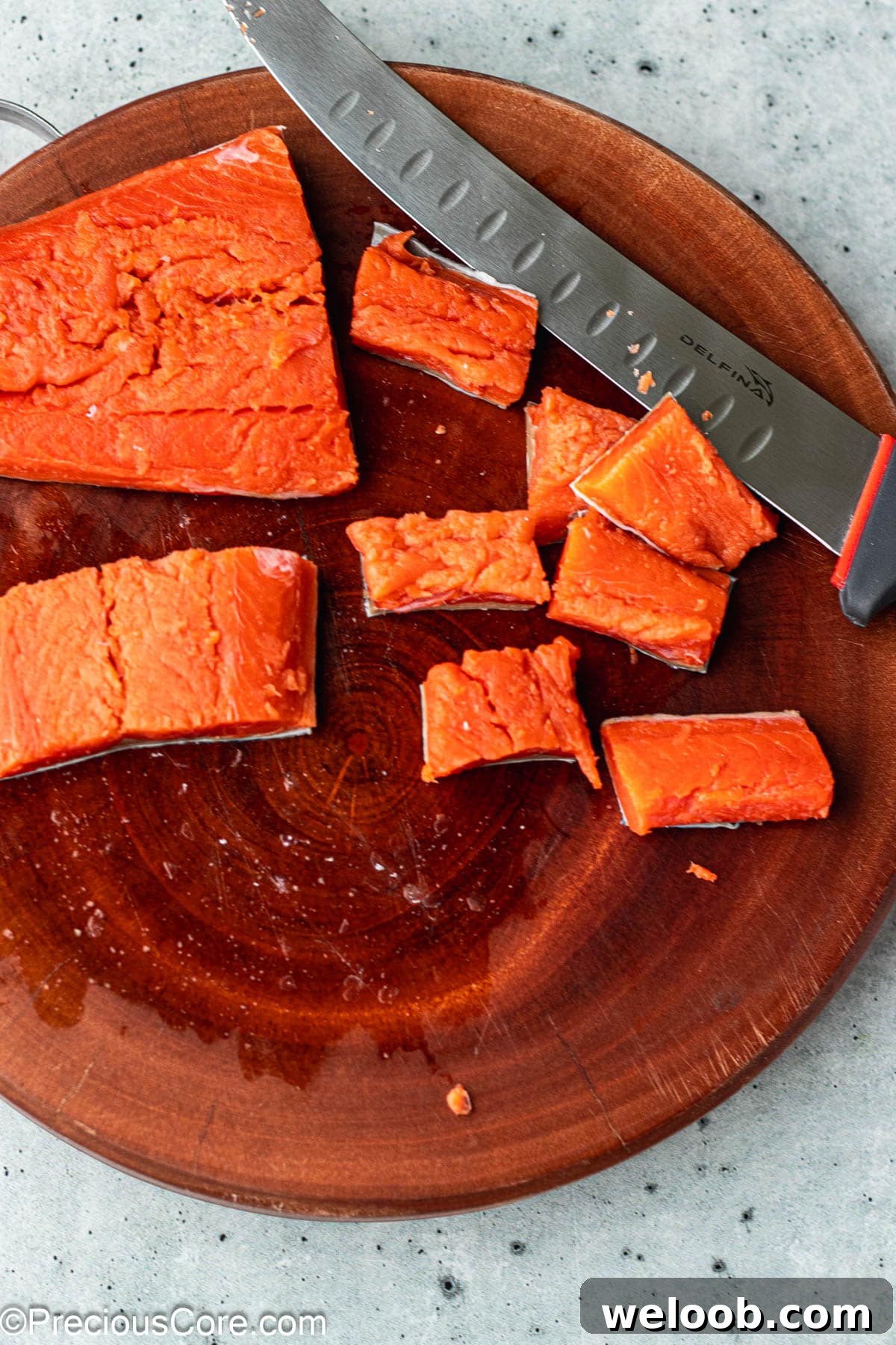 Cut salmon on a chopping board.