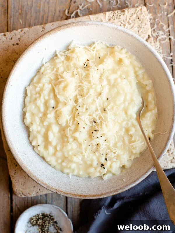 An overhead shot of cacio e pepe risotto in a bowl