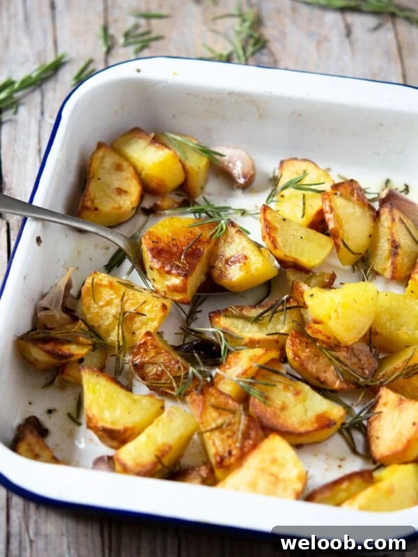 A tray of Italian roast potatoes with garlic and rosemary