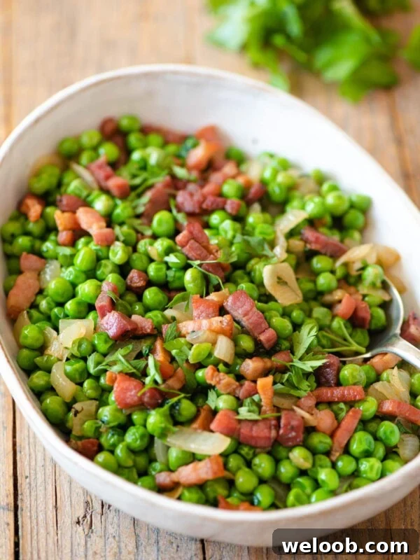 Peas and pancetta in a large serving bowl
