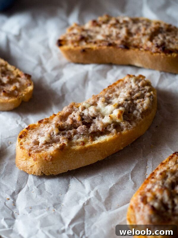 This two ingredient stracchino and sausage crostini is so simple and crazy delicious.