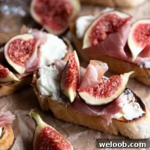 A close up cropped image of fig crostini with Pecorino and prosciutto.