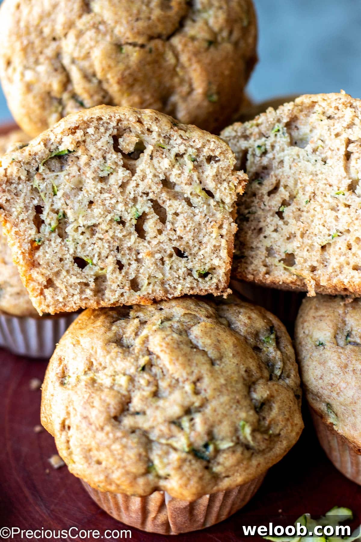 Zucchini muffin cut in half to show texture.