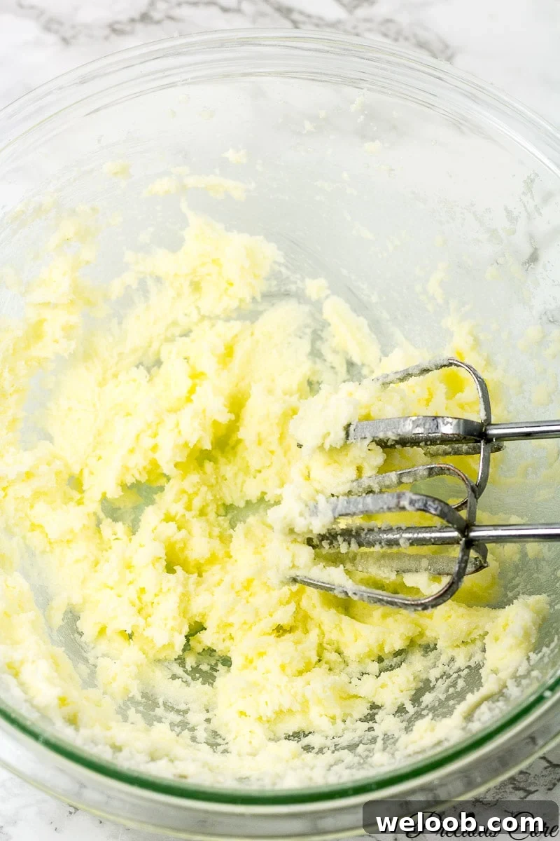 Creaming butter an sugar in a mixing bowl.