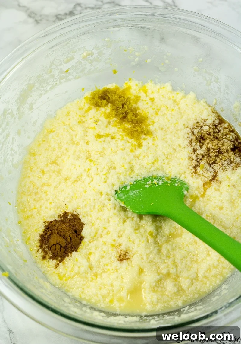 Wet ingredients for apple cake with spices added.