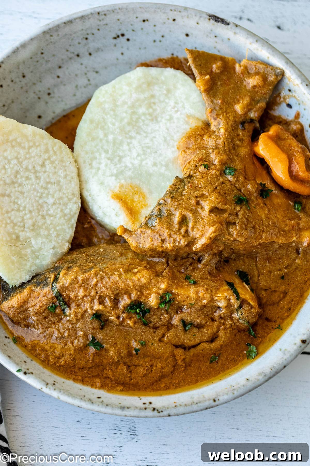 Njangsa Sauce Recipe from Cameroon: How to Make Authentic Njansa Stew 3 White yams and njangsa sauce in a bowl.