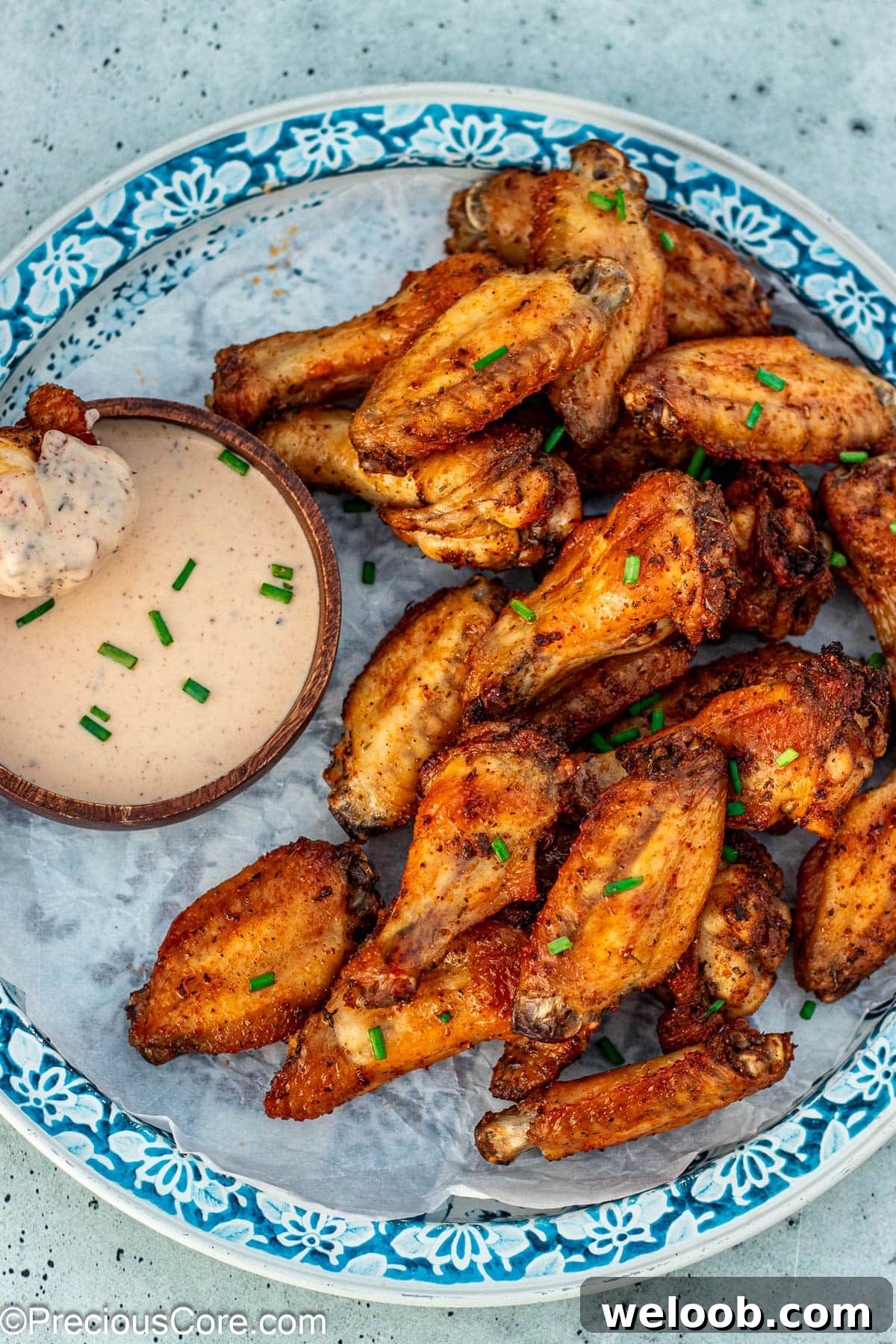 Baked dry rub chicken wing coated in ranch.