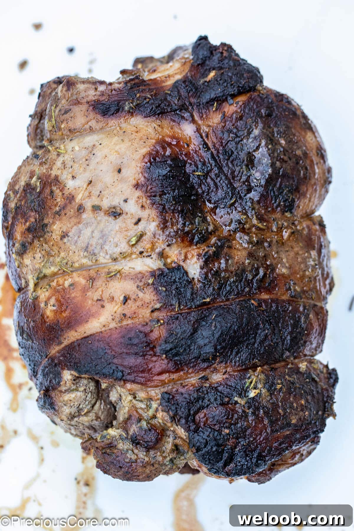 Whole roasted boneless leg of lamb.